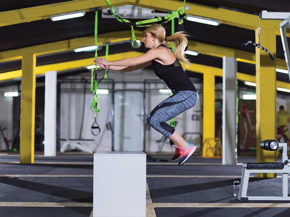 Jumping-on-Box-Oxygen Woman Performing Box jumps
