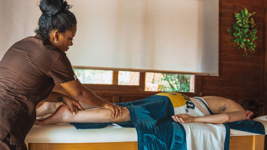 woman getting a massage on Corona Island