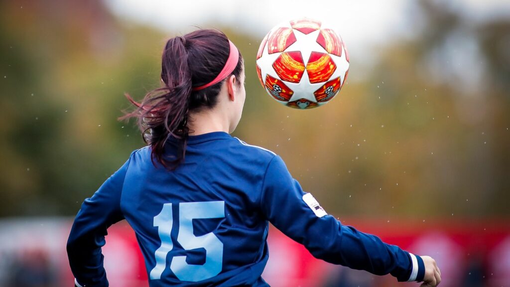 Image by My Profit Tutor on Unsplash woman playing soccer sports to try