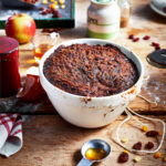 gingerbread christmas pudding recipe in a white bowl in a kitchen