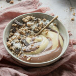 Healthy Chocolate Air Fryer Granola served in a smoothie bowl